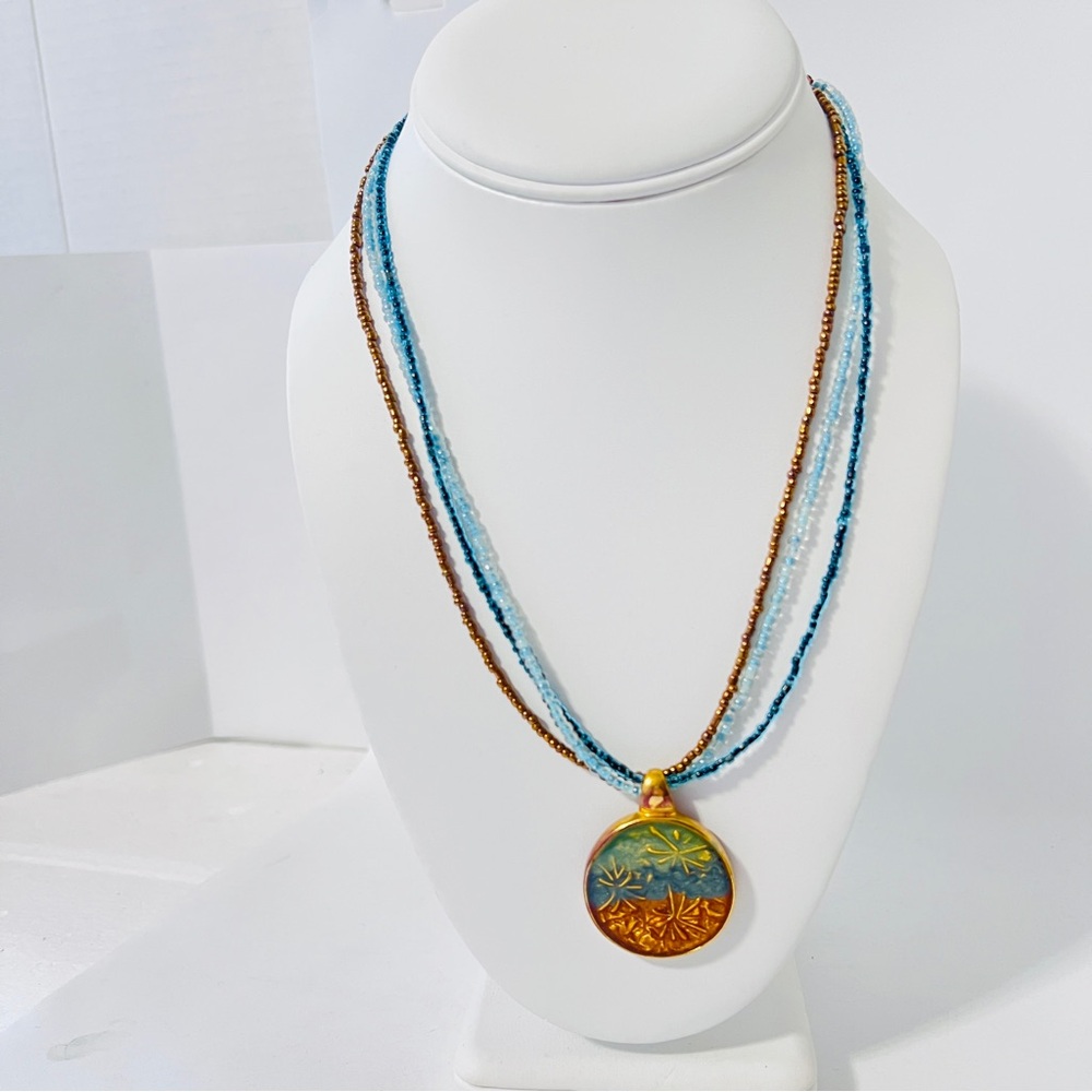 Kenneth Cole Necklace Multi Strand Bead Round Pendant